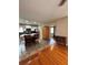 Open kitchen and dining area features a center island and stainless steel appliances at 114 N Arcturas Ave, Clearwater, FL 33765