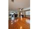 Spacious living room flows into the kitchen with hardwood flooring and natural light at 114 N Arcturas Ave, Clearwater, FL 33765