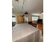 View of the kitchen with a large table transitioning into the living room at 114 N Arcturas Ave, Clearwater, FL 33765