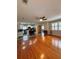 Spacious living room flows into the kitchen with hardwood flooring and natural light at 114 N Arcturas Ave, Clearwater, FL 33765