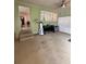 The living room has wall to wall carpeting, a window, and a closet at 114 N Arcturas Ave, Clearwater, FL 33765