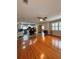 Spacious living room flows into the kitchen with hardwood flooring and natural light at 114 N Arcturas Ave, Clearwater, FL 33765