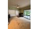 Bright office with ceiling fan, double closets, and sliding glass door to patio at 114 N Arcturas Ave, Clearwater, FL 33765