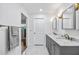 Elegant bathroom features marble countertop, dual sinks, and modern fixtures at 1251 Fairway Dr, Dunedin, FL 34698