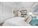 Bright bedroom with a ceiling fan, light walls, and a closet at 1251 Fairway Dr, Dunedin, FL 34698
