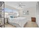 Relaxing bedroom with soft lighting, neutral tones, and ample closet space at 1251 Fairway Dr, Dunedin, FL 34698