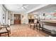 Bright living room with an open floor plan leading to the kitchen and dining area at 1251 Fairway Dr, Dunedin, FL 34698
