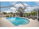Relaxing screened-in pool with inviting lounge chairs, ideal for outdoor enjoyment and recreation at 1251 Fairway Dr, Dunedin, FL 34698