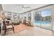 Cozy sun room with lots of windows looking out to the backyard pool at 1251 Fairway Dr, Dunedin, FL 34698