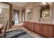 Luxurious bathroom with a double vanity, soaking tub, walk-in shower, and elegant finishes at 12713 Grand Traverse Dr, Dade City, FL 33525