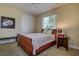 Bedroom featuring a bed, window, and closet with clean, simple decor at 12713 Grand Traverse Dr, Dade City, FL 33525