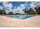 Stunning community pool with blue water, tiled deck, and plenty of seating at 12713 Grand Traverse Dr, Dade City, FL 33525