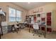 Bright craft room with organized shelving and multiple workstations with sewing machines at 12713 Grand Traverse Dr, Dade City, FL 33525
