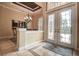 Elegant entry foyer featuring decorative glass double doors and a designer rug at 12713 Grand Traverse Dr, Dade City, FL 33525