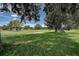 Picturesque golf course fairway with well-manicured grass and mature trees at 12713 Grand Traverse Dr, Dade City, FL 33525