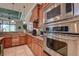 Modern kitchen with stainless appliances, granite countertops, and ample cabinet space at 12713 Grand Traverse Dr, Dade City, FL 33525