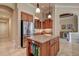 Bright eat-in kitchen featuring granite counters, stainless steel appliances, and wood cabinetry at 12713 Grand Traverse Dr, Dade City, FL 33525