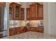 Close up view of the kitchen featuring wood cabinets and granite counters at 12713 Grand Traverse Dr, Dade City, FL 33525