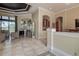 Bright living area with tile flooring, tray ceilings, and expansive windows overlooking outdoor space at 12713 Grand Traverse Dr, Dade City, FL 33525