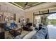 Open-concept design with the living room, dining area and kitchen seamlessly connected with screened patio at 12713 Grand Traverse Dr, Dade City, FL 33525