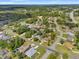 Aerial view showing the community's layout, quiet streets, and ample green spaces around the homes at 13991 Coronado Dr, Spring Hill, FL 34609