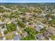 A serene aerial view highlighting the community's layout, tree-lined streets, and green spaces at 13991 Coronado Dr, Spring Hill, FL 34609