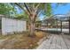 Backyard area features a screened in pool and shed at 13991 Coronado Dr, Spring Hill, FL 34609
