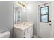 Bathroom featuring a white sink and vanity plus a large mirror at 13991 Coronado Dr, Spring Hill, FL 34609