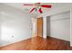 Bedroom with a ceiling fan, closet, and doorway at 13991 Coronado Dr, Spring Hill, FL 34609