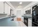 Functional kitchen with white cabinets and updated appliances at 13991 Coronado Dr, Spring Hill, FL 34609