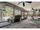 Covered lanai featuring ceiling fans and views of the screened pool at 13991 Coronado Dr, Spring Hill, FL 34609