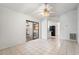 Bright living room featuring tile flooring and sliding glass doors to the patio at 13991 Coronado Dr, Spring Hill, FL 34609