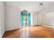 Inviting living room with large window and hardwood floors at 13991 Coronado Dr, Spring Hill, FL 34609