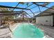 The pool area features a screened enclosure and hot tub at 13991 Coronado Dr, Spring Hill, FL 34609