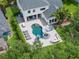 Aerial view of backyard featuring custom pool, spa, patio, and outdoor living area at 14617 Galt Lake Dr, Tampa, FL 33626