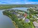 Aerial view of home and community on a scenic lake surrounded by lush greenery at 14617 Galt Lake Dr, Tampa, FL 33626
