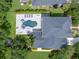Aerial view of backyard featuring custom pool, spa, lounge area, and trampoline at 14617 Galt Lake Dr, Tampa, FL 33626