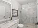 Elegant bathroom with marble countertop, sink, and a walk-in shower at 14617 Galt Lake Dr, Tampa, FL 33626