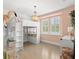 Bedroom with lofted bed, chandelier, and shuttered windows at 14617 Galt Lake Dr, Tampa, FL 33626