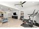 Spacious bonus room that includes exercise equipment, comfortable furniture, and ample space for recreation at 14617 Galt Lake Dr, Tampa, FL 33626