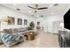 Bright bonus room featuring a comfortable seating area, modern decor, and seamless access to other areas of the home at 14617 Galt Lake Dr, Tampa, FL 33626