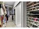 Organized walk-in closet featuring shelves and hanging space for clothes and shoes at 14617 Galt Lake Dr, Tampa, FL 33626