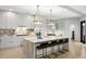 Spacious kitchen features an island with bar seating and stylish pendant lighting at 14617 Galt Lake Dr, Tampa, FL 33626