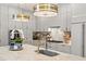 Bright kitchen features a large island, stainless steel appliances, and designer lighting at 14617 Galt Lake Dr, Tampa, FL 33626