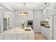 Bright kitchen features a large island, stainless steel appliances, and designer lighting at 14617 Galt Lake Dr, Tampa, FL 33626
