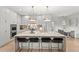 Modern kitchen island with seating and stylish lighting fixture at 14617 Galt Lake Dr, Tampa, FL 33626