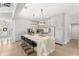 Bright kitchen features a large island, stainless steel appliances, and designer lighting at 14617 Galt Lake Dr, Tampa, FL 33626