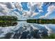 Scenic lake view reflecting the sky and trees at 14617 Galt Lake Dr, Tampa, FL 33626