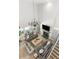 Bright, open living room featuring high ceilings, fireplace, and modern chandelier with neutral furniture and light wood floors at 14617 Galt Lake Dr, Tampa, FL 33626