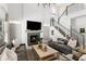 Bright living room features a fireplace, a modern staircase, and high ceilings at 14617 Galt Lake Dr, Tampa, FL 33626